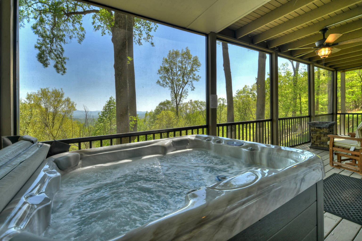 Dancing Bear has an magnificent view of the North GA Mountains, plus a hot tub and large